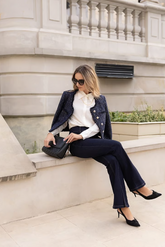 a lady in a white lapel shirt, a sequin tweed jacket and a pair of jeans